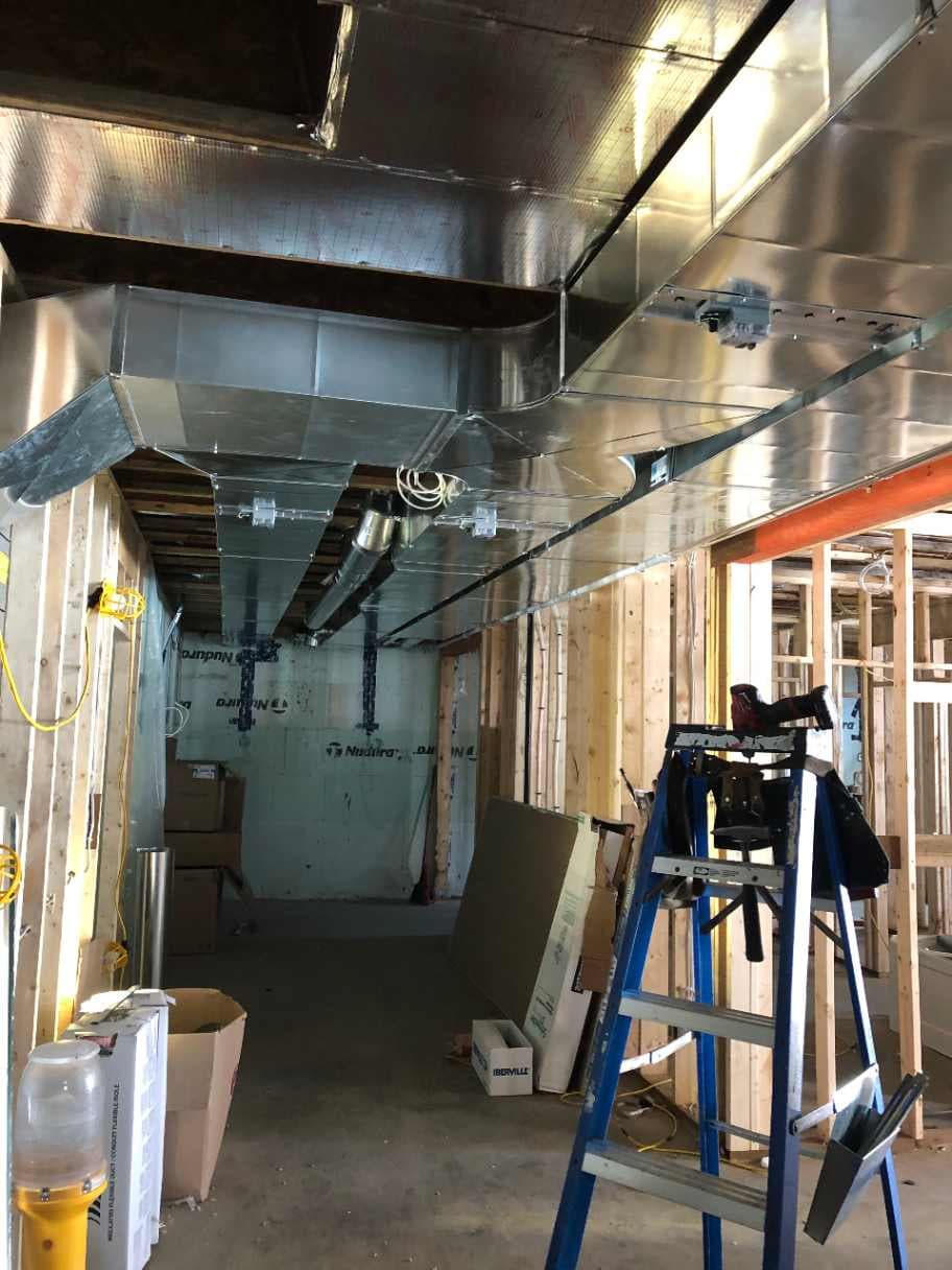 Galvanized ducts with zone dampers for multi-zone heating and cooling