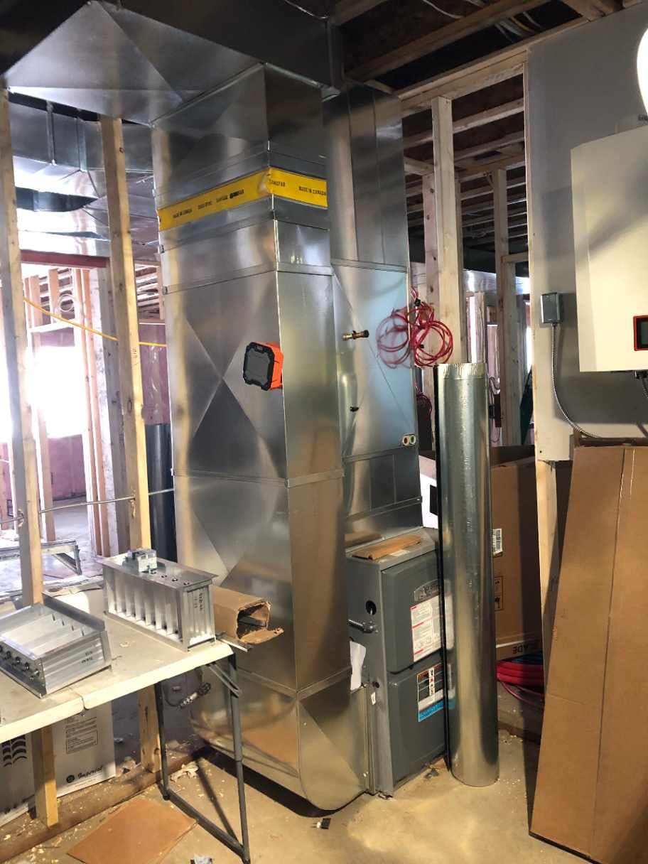 Overhead duct layout for a multi-zoned heating system