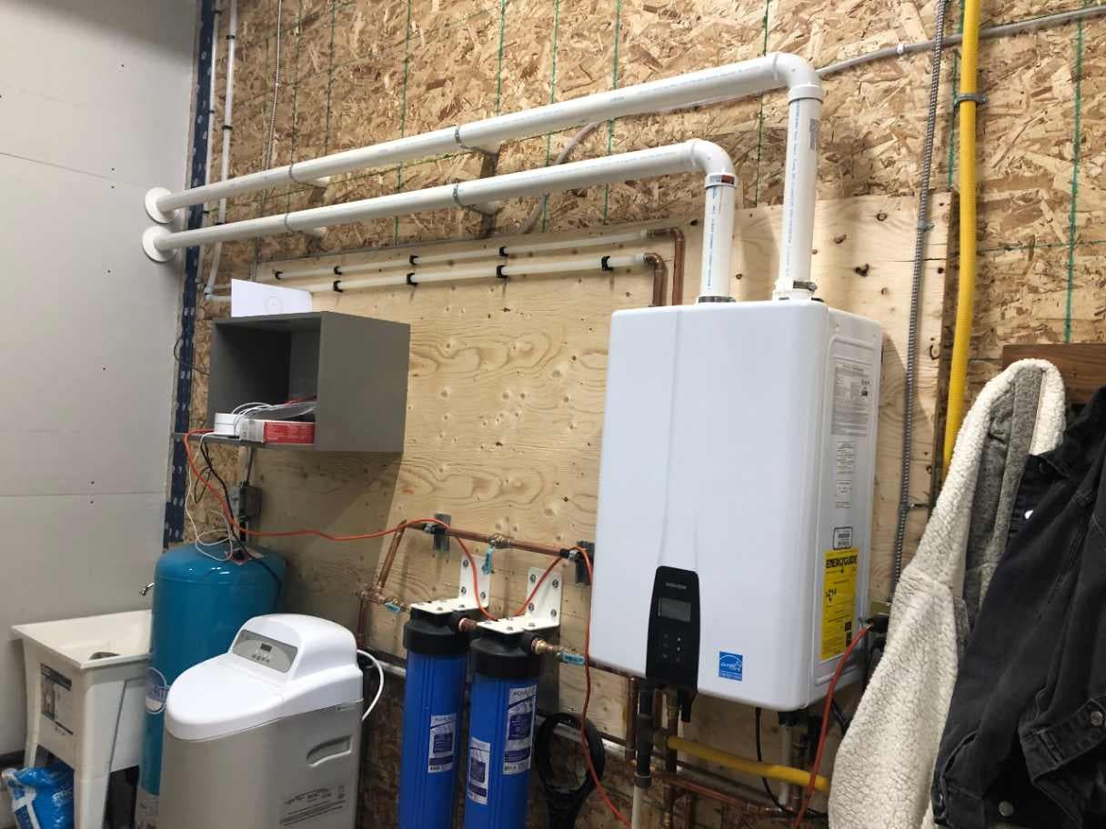 Tankless on-demand water heater with gas and vent connections